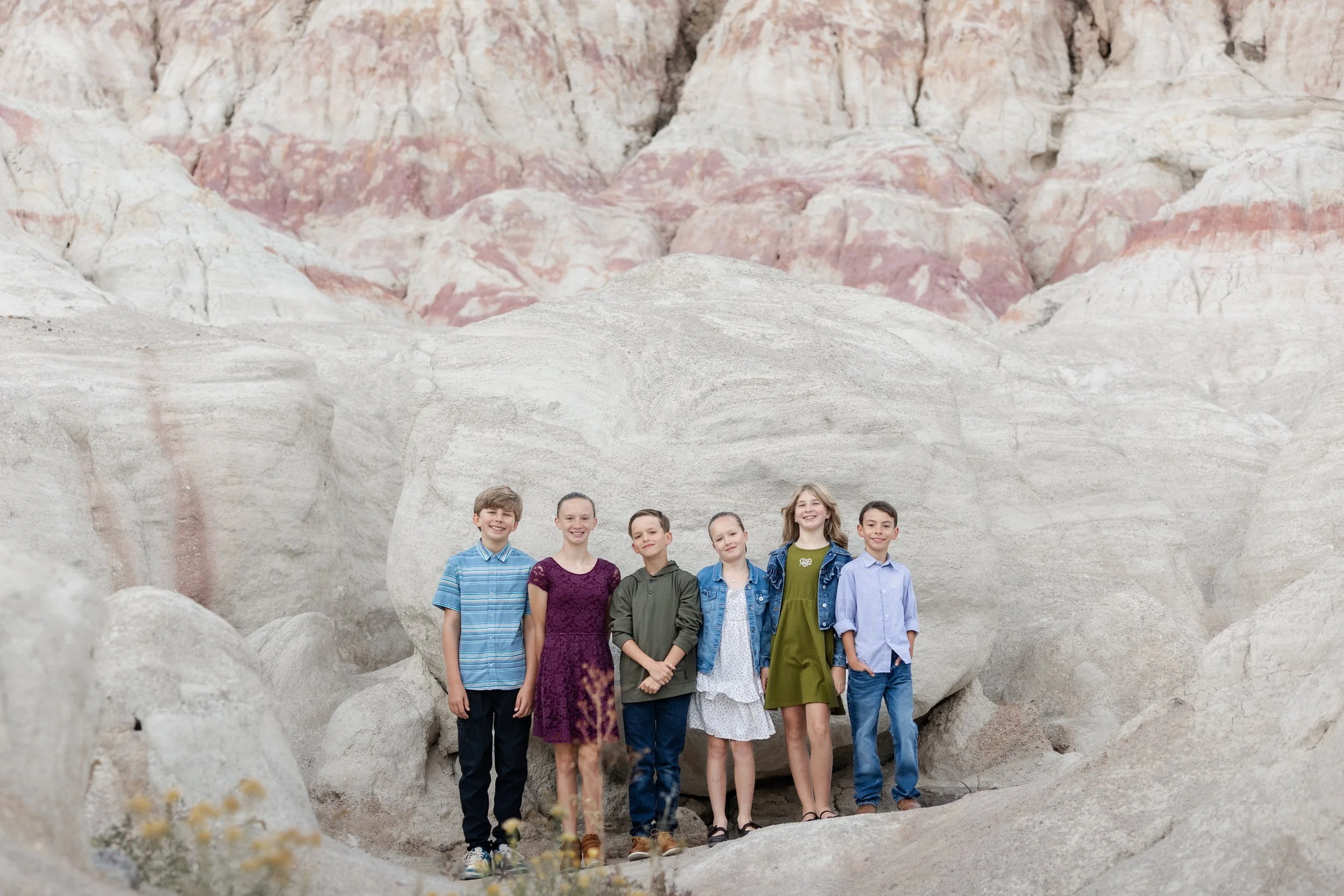 Group of children ages range from 8 years old to 11 years old. Standing in the Painted Mines in Colorado Springs, Colorado. Standing and posed for a beautiful portrait. 