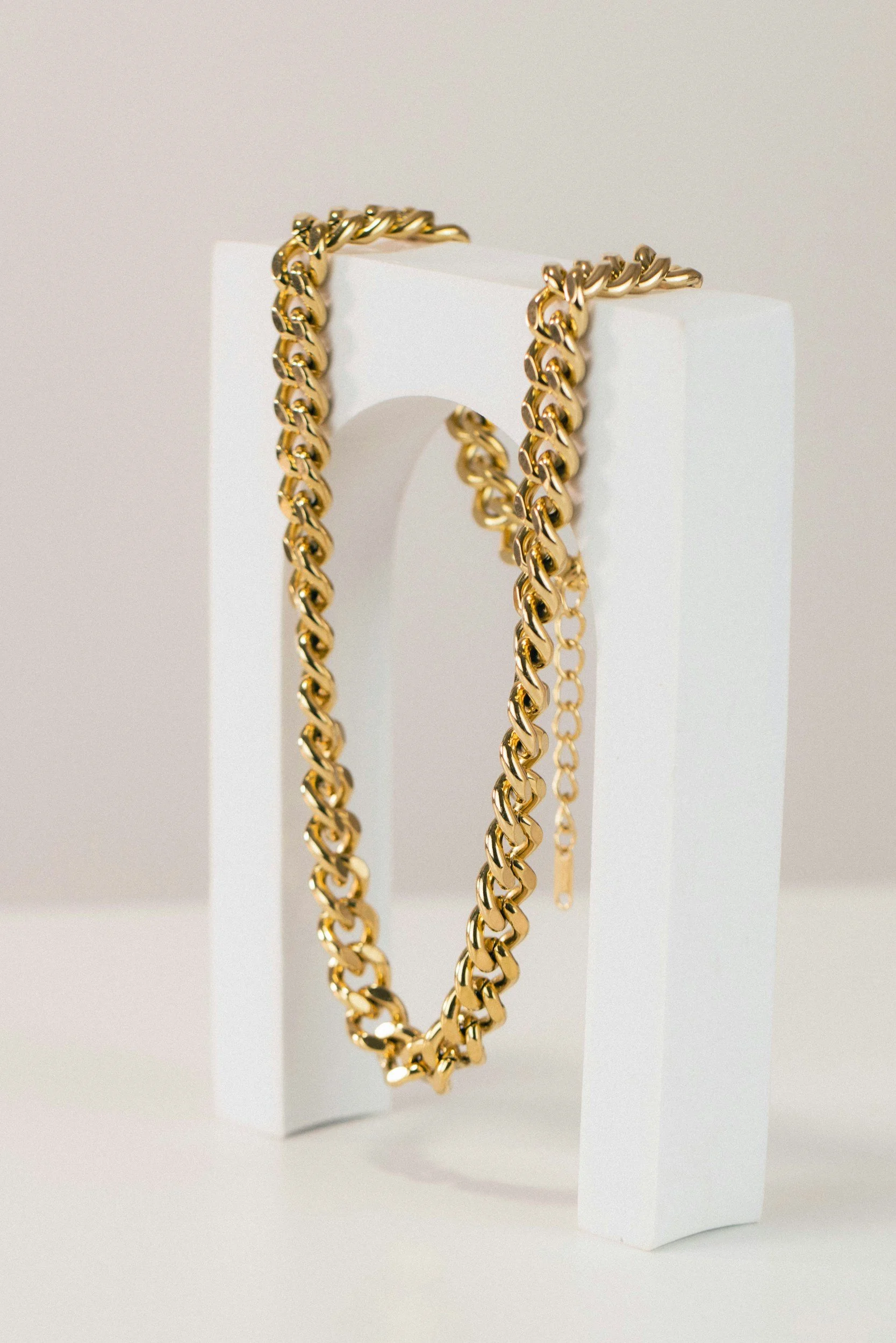 men's gold chain on display