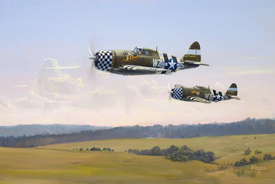 Two vintage military fighter planes flying over a landscape with fields and trees, with clouds and a colorful sky in the background.