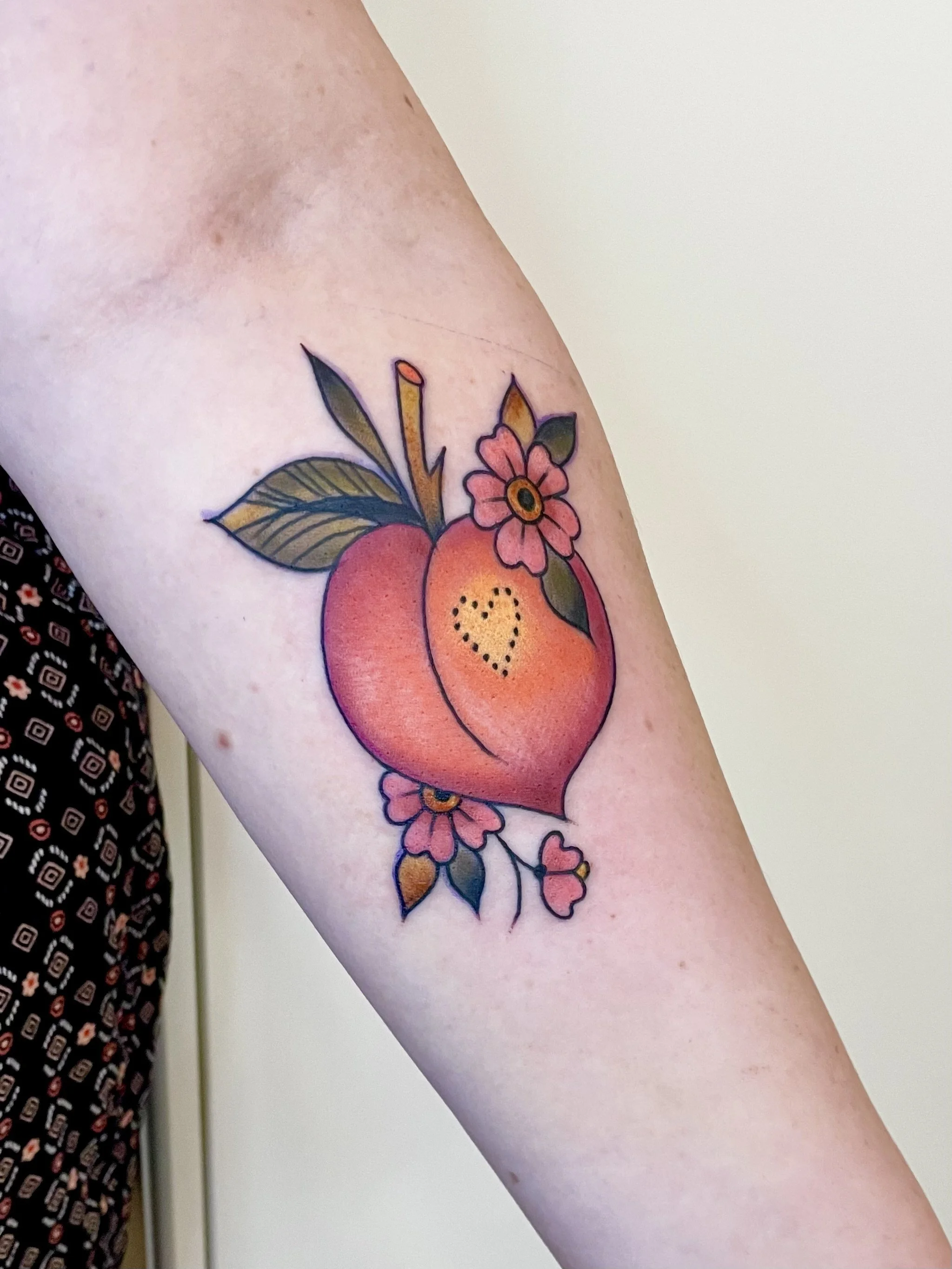 Traditional peach tattoo by Jennifer Lynn at Crown Jewel Tattoo in Tampa Florida.
