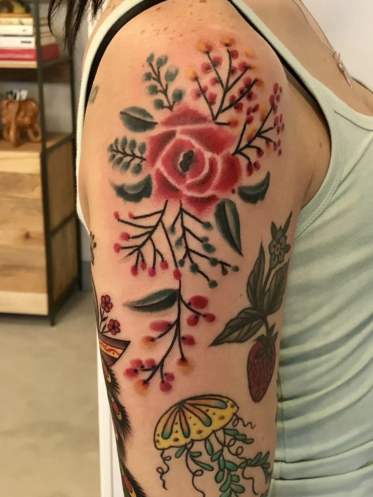 Watercolor rose tattoo by Jennifer Lynn at Crown Jewel Tattoo in Tampa Florida.