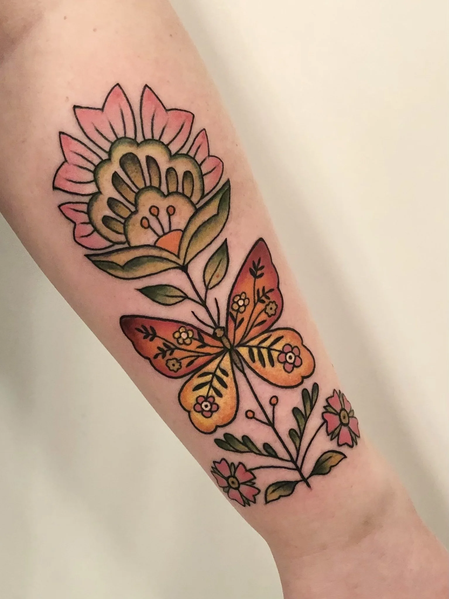 Traditional flower tattoo by Jennifer Lynn at Crown Jewel Tattoo in Tampa Florida 