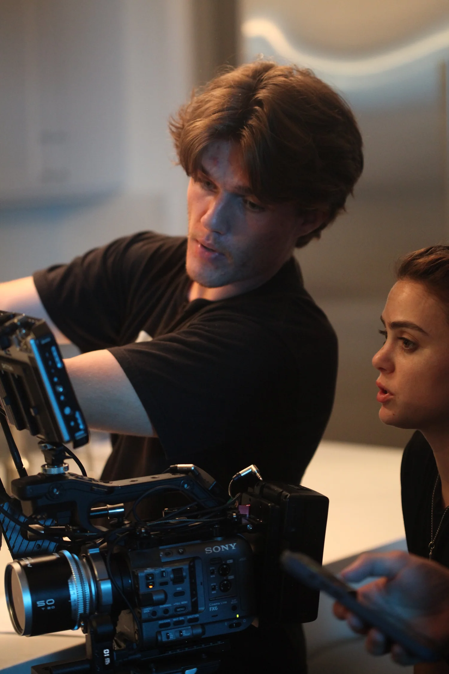 Sonia on set beside the camera