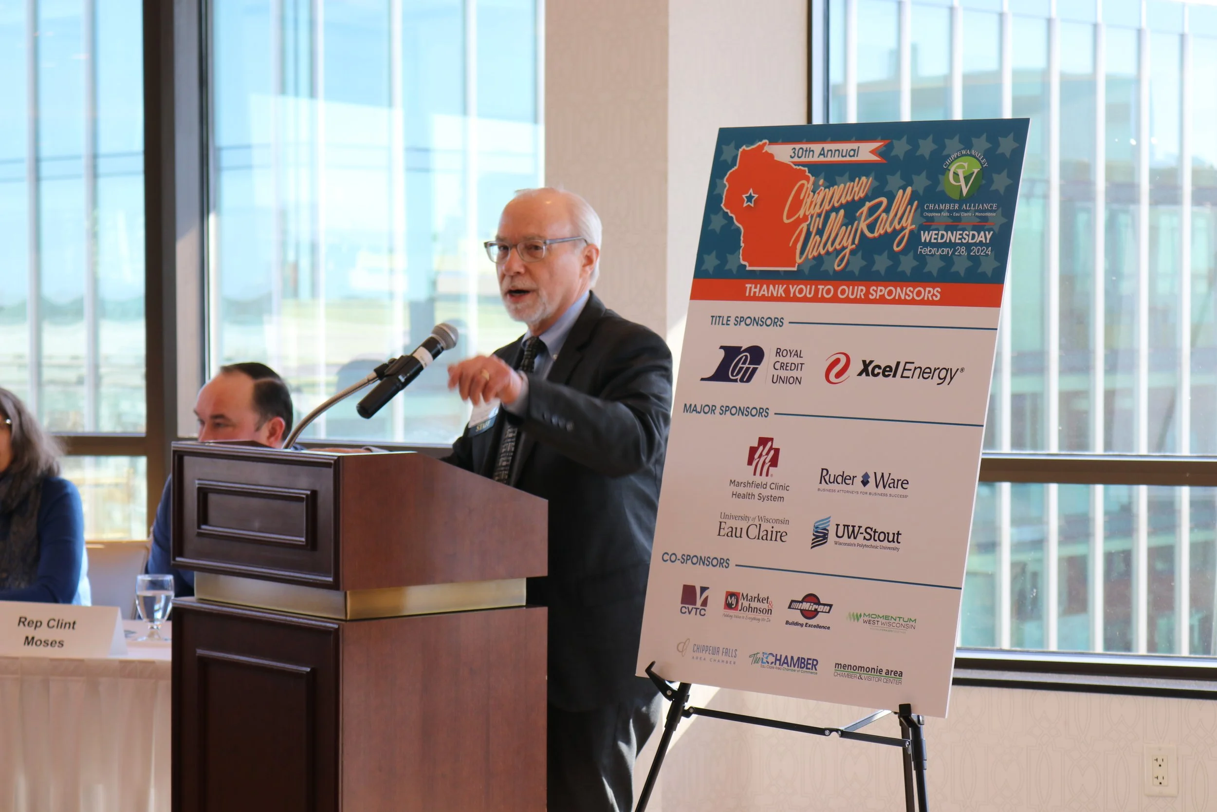 Scott standing at a podium talking to an audience.