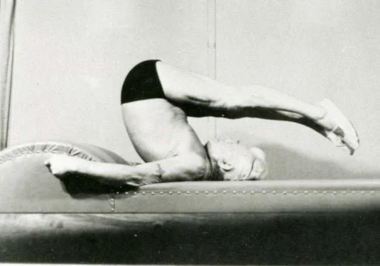 Joseph Pilates demonstrating an exercise in his original New York Contrology studio