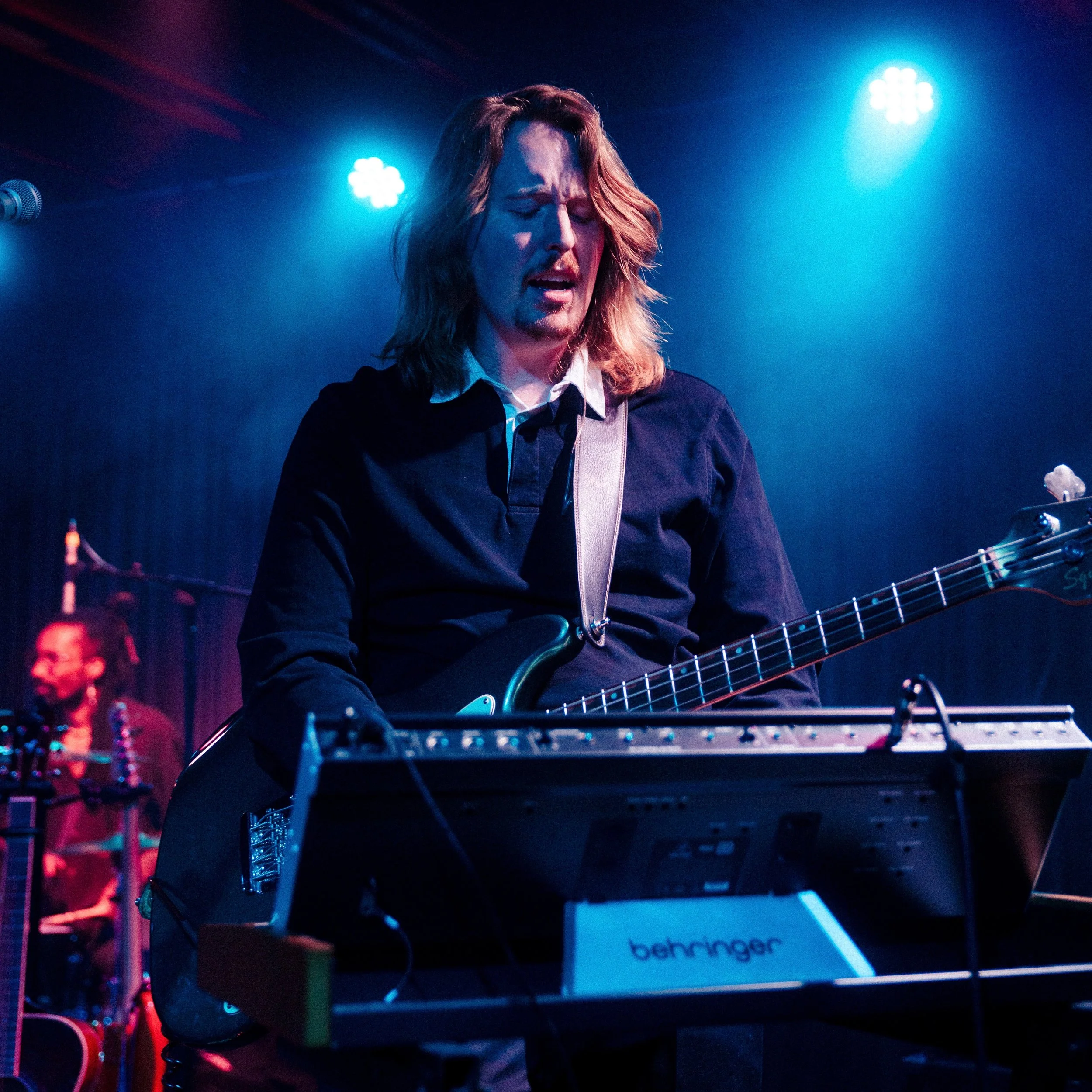 Photo of Gus performing music at Crescent Ballroom with Pariah Pete. Photo taken by