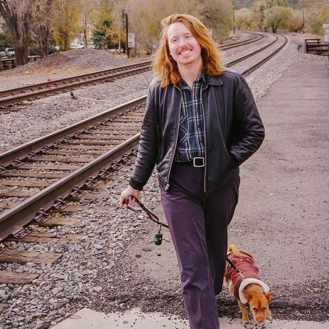 Photo of Gus in Flagstaff, Arizona, with his dog, Cosmo.