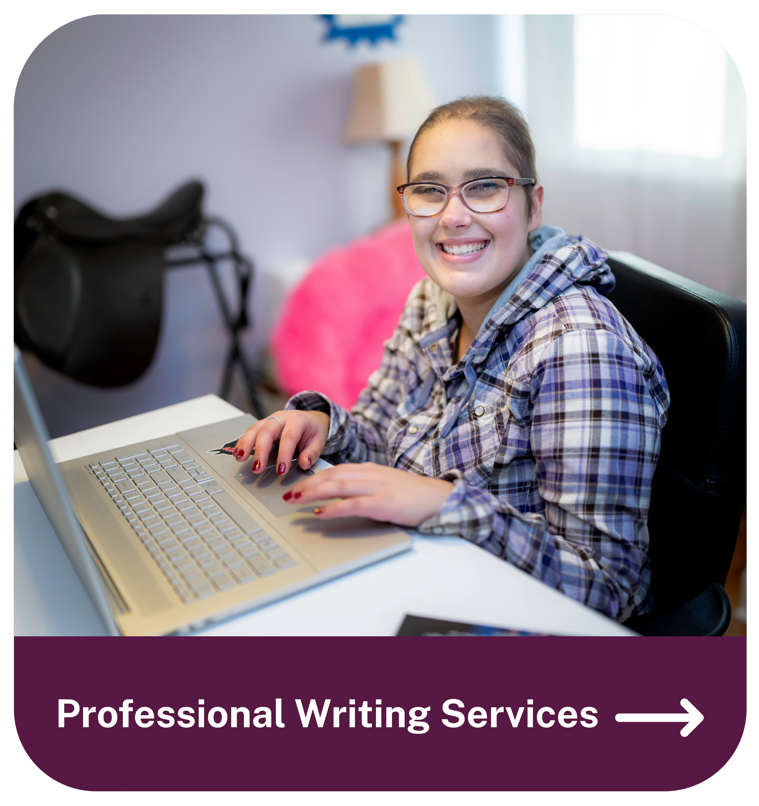 A young woman with glasses and a plaid shirt smiling at a computer desk in a home office, promoting professional writing services.