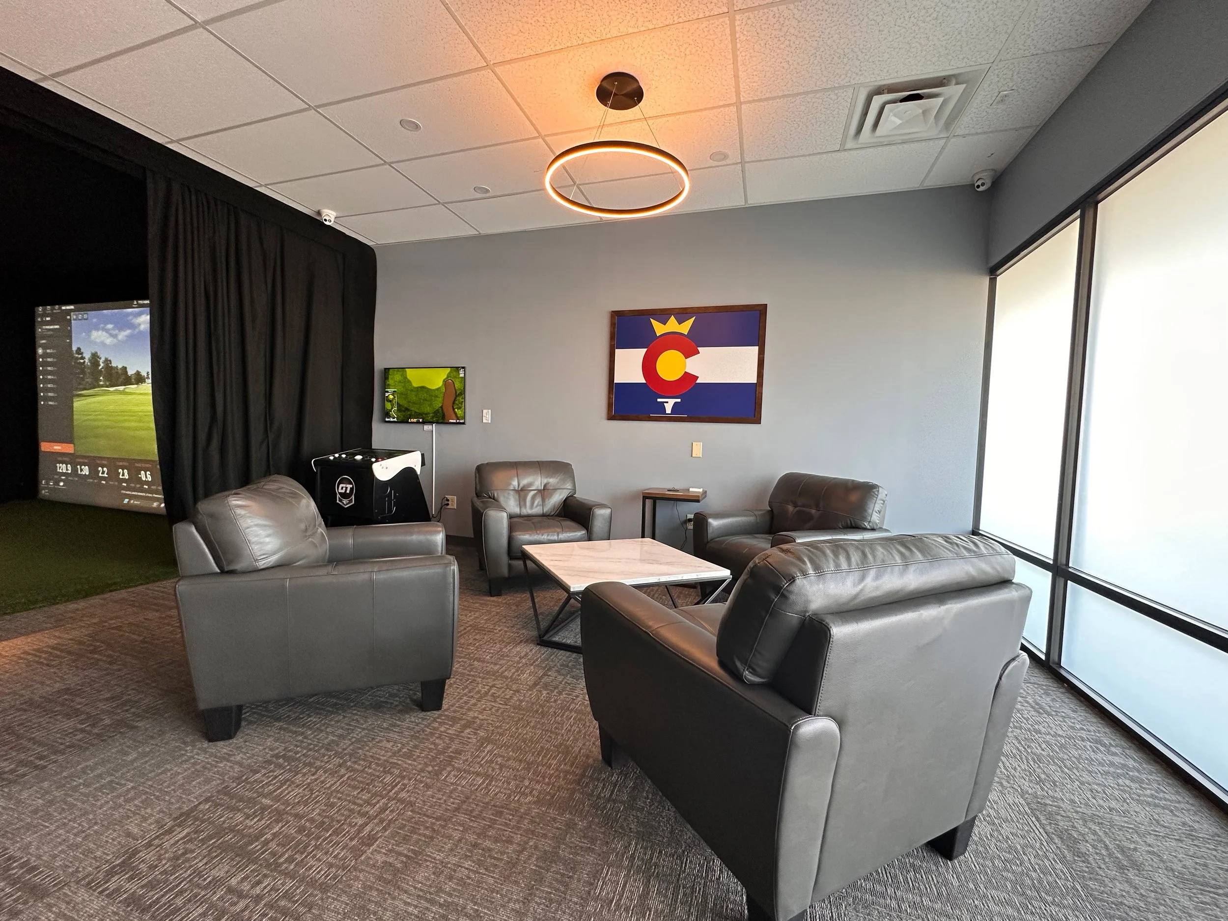 A modern golf simulator lounge.