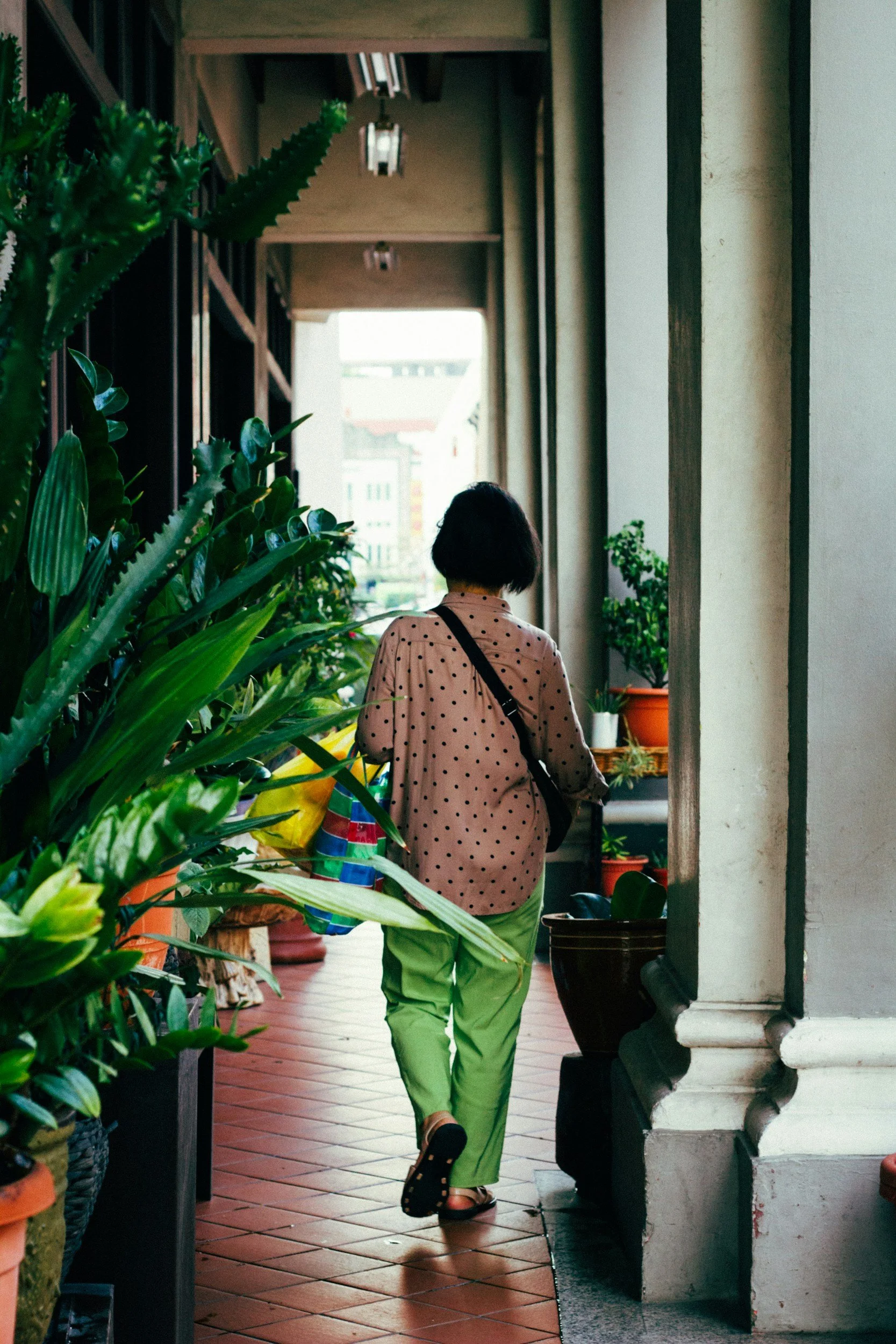 Woman walking down street in Singapore