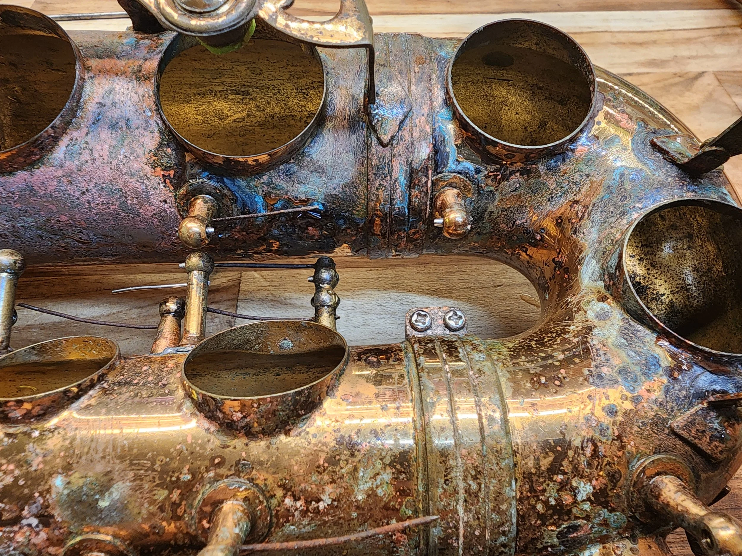 Damaged alto saxophone before cleaning