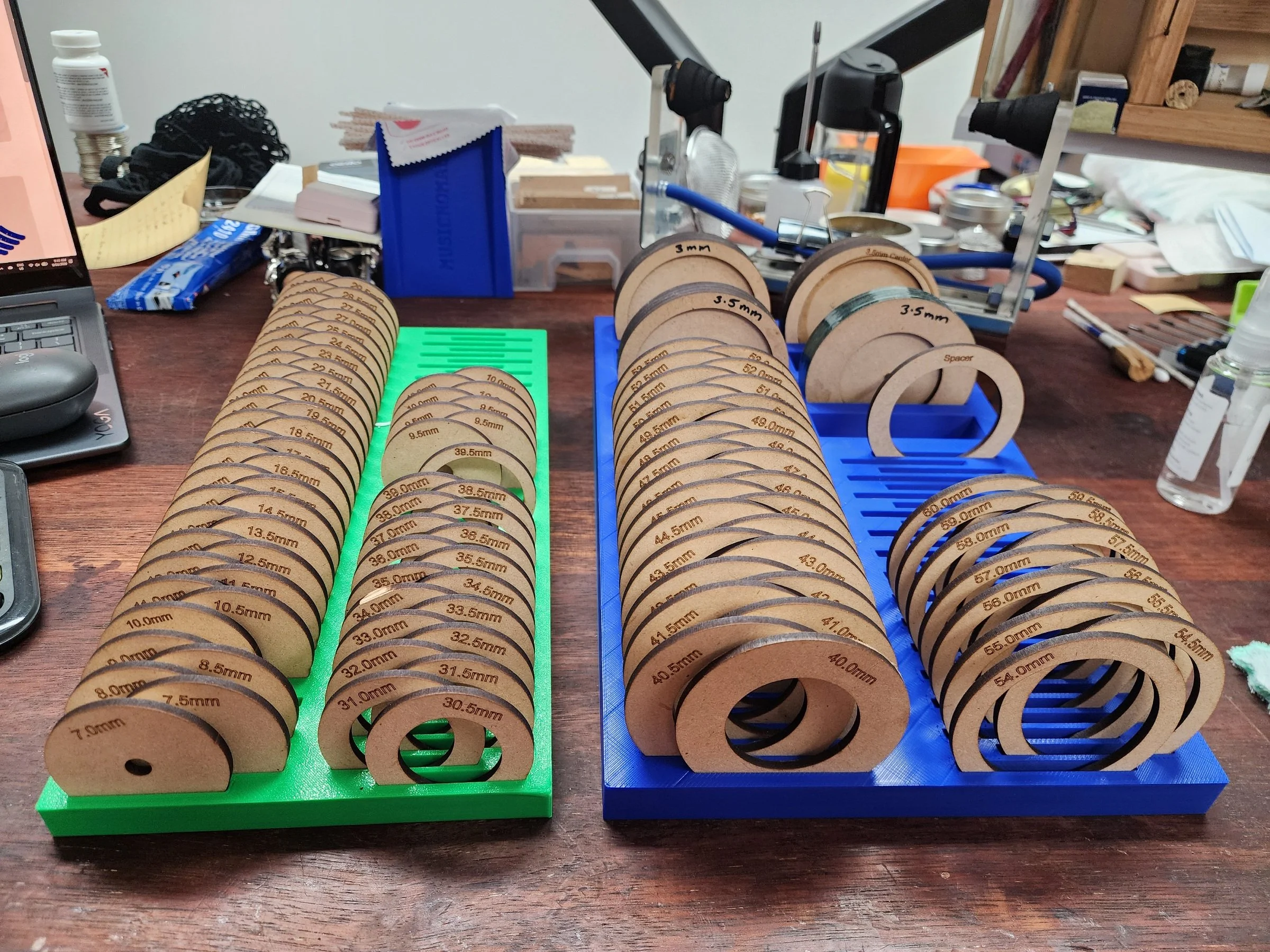 3D printed and laser-cut tools for pad making.