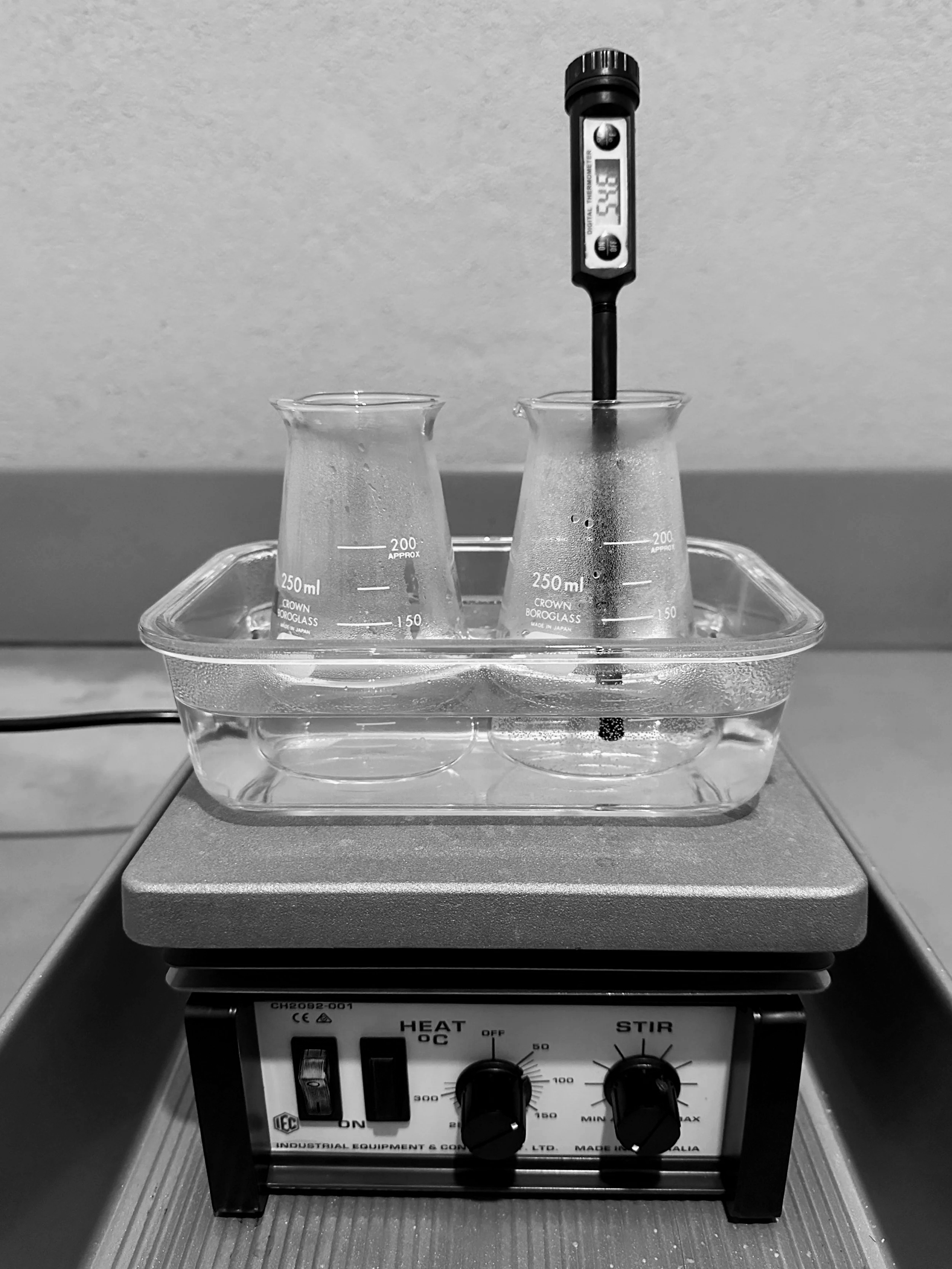 Preparing to make Silver Gelatin Emulsion. Heating Silver Nitrate solution, and a solution on KBr, KI, and gelatin.