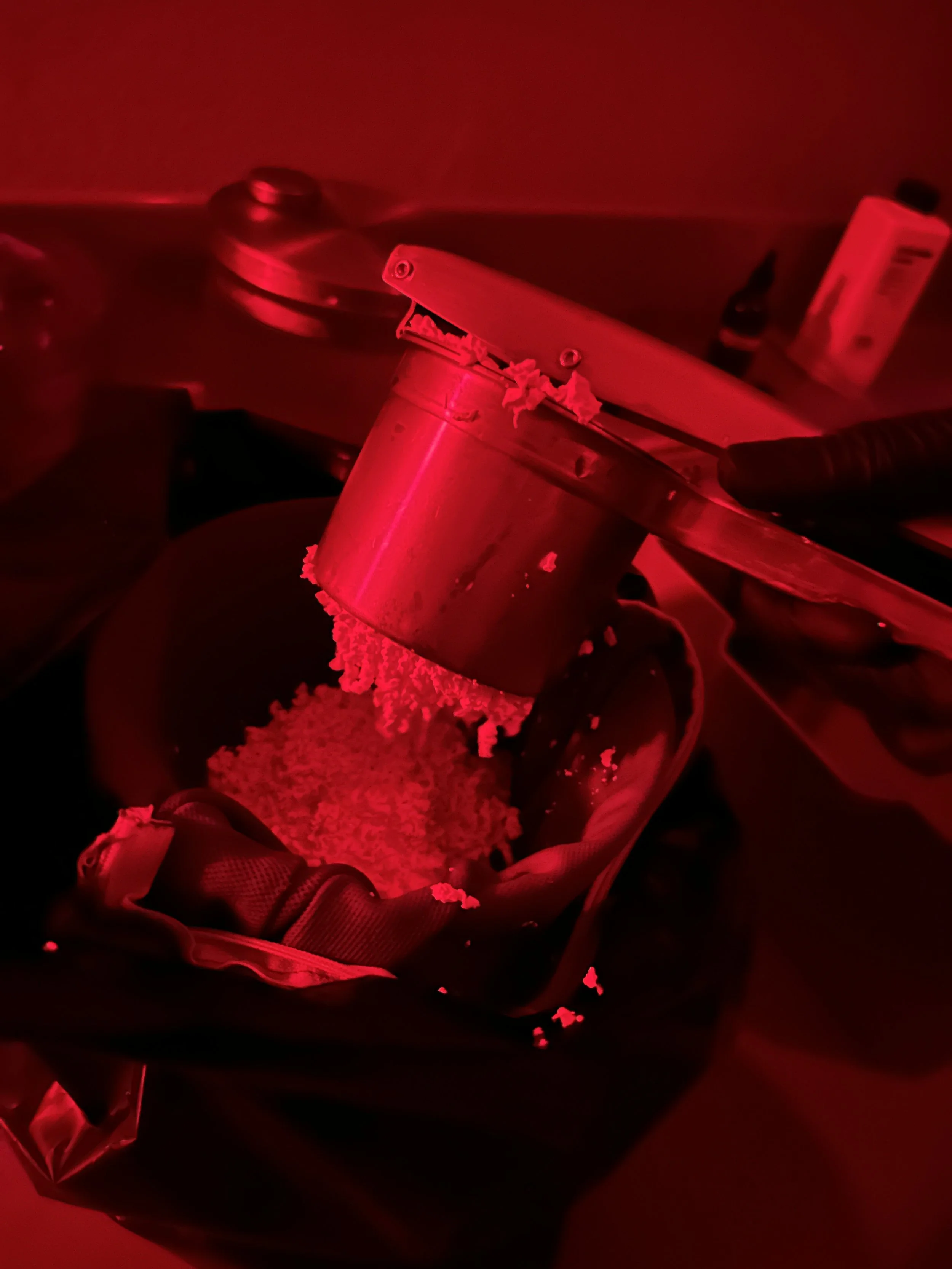 Making silver gelatin emulsion, noodling the chilled emulsion to wash it.