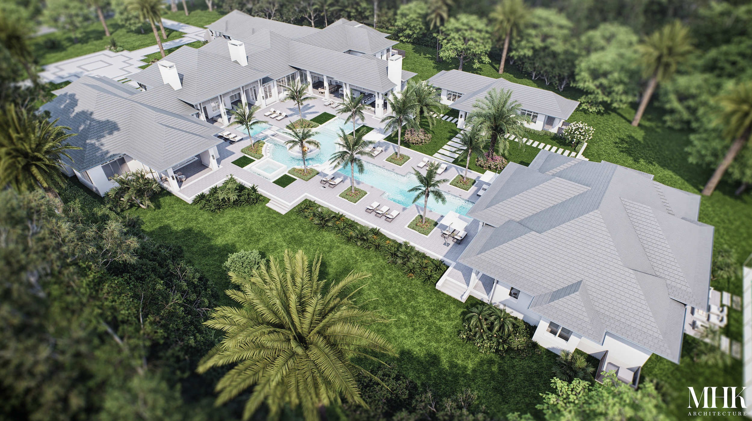 Aerial view of a luxurious residential property with a large, modern house featuring multiple gray roofs, an outdoor swimming pool, surrounded by palm trees, lush green lawn, and landscaped gardens.