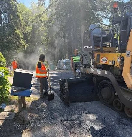 Road crew repaving a street in Lake Forest