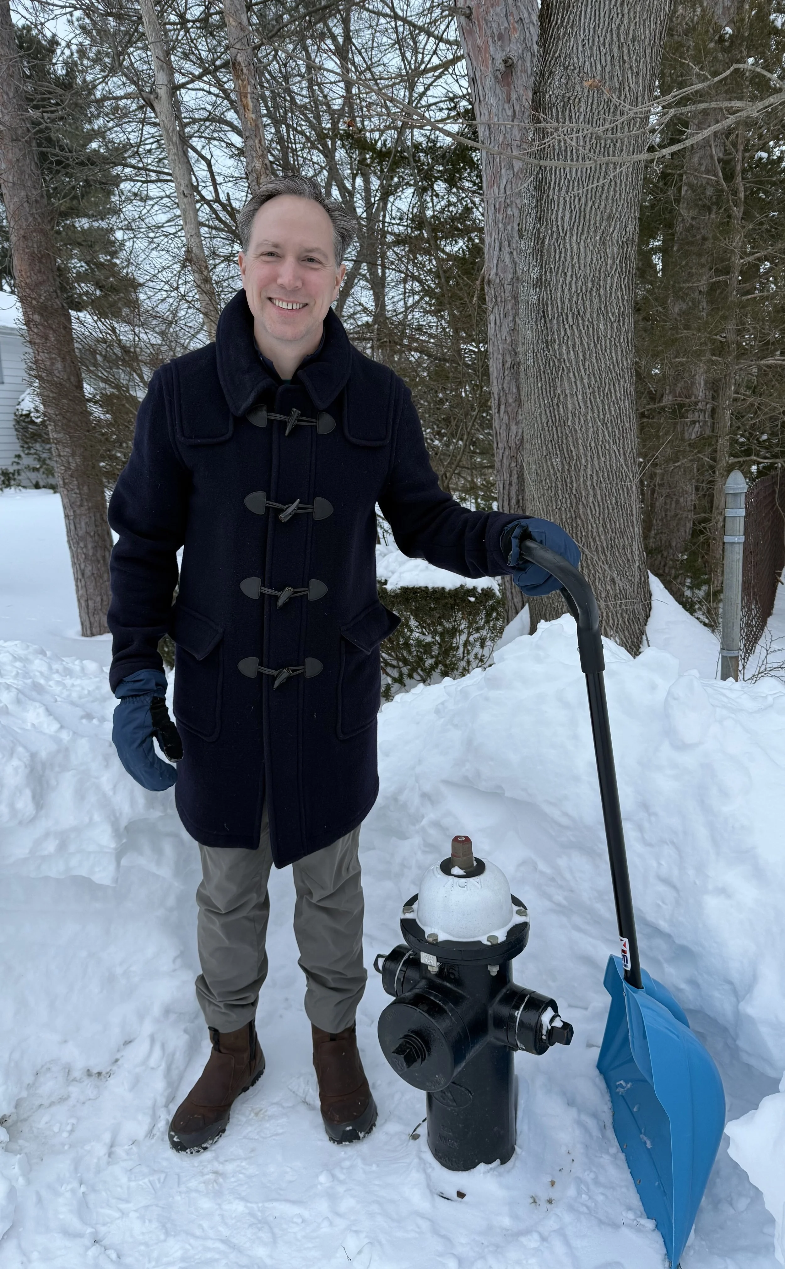 Drew with a freshly shoveled fire hydrant