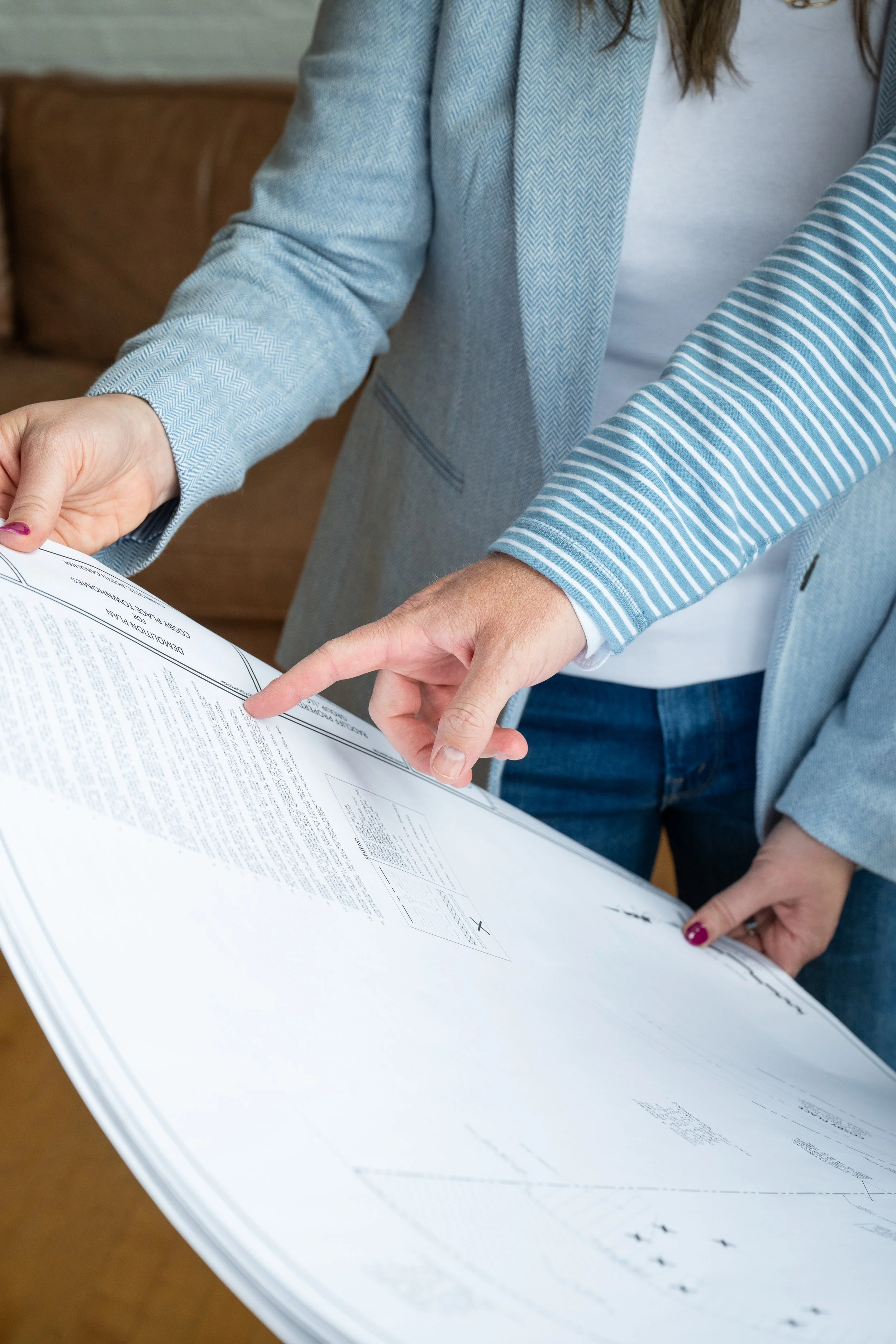 Custom homebuilder reading blueprints