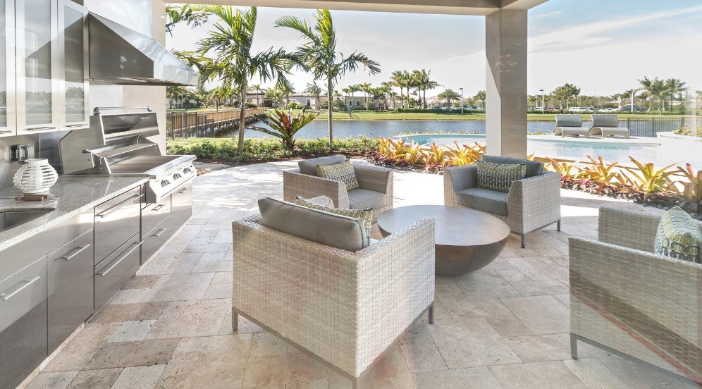 Outdoor living space with a covered patio, modern lounge furniture, and a scenic desert view for relaxation and entertaining.