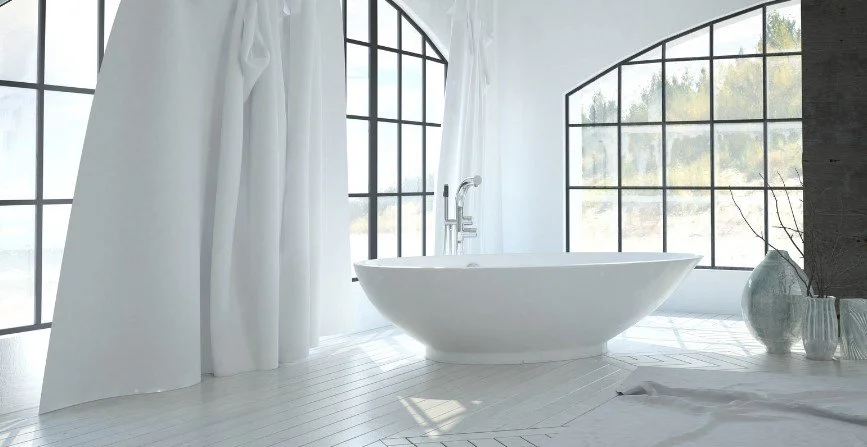 Freestanding oval bathtub, floor-to-ceiling arched windows,