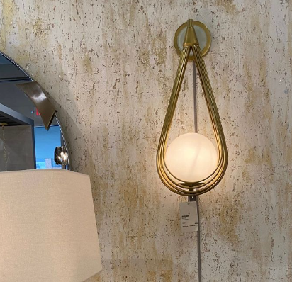 Minimalist gold wall sconce 