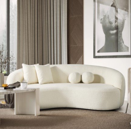 curved white sofa, round accent pillows