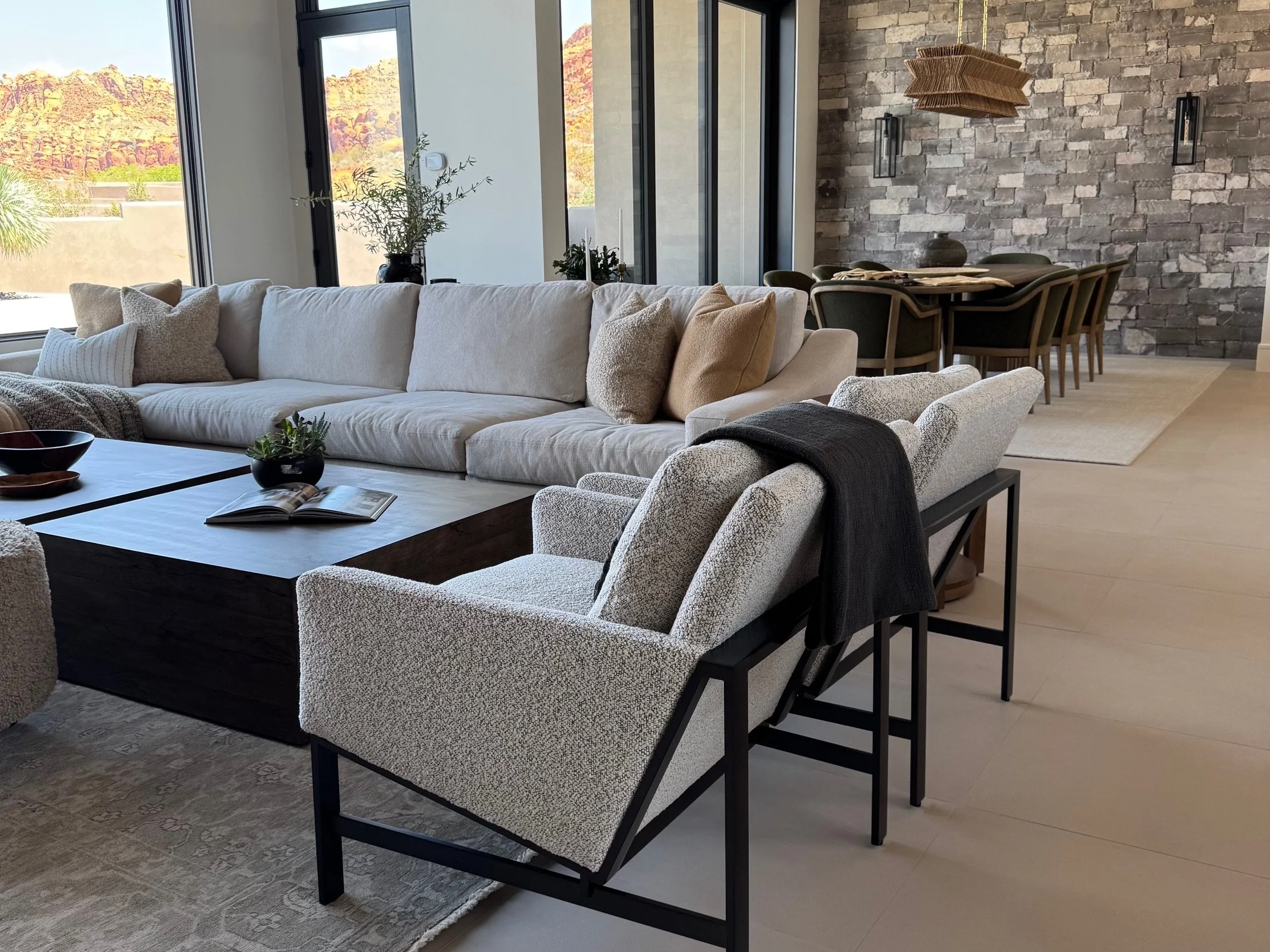 Modern organic living room filled with natural light, layered textures, and calming tones