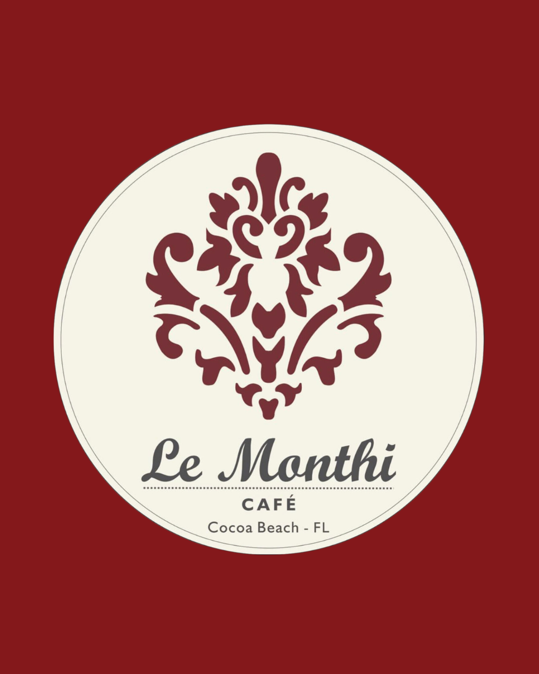 Logo for Le Monthi Café with a decorative floral design and text indicating it is located in Cocoa Beach, Florida.