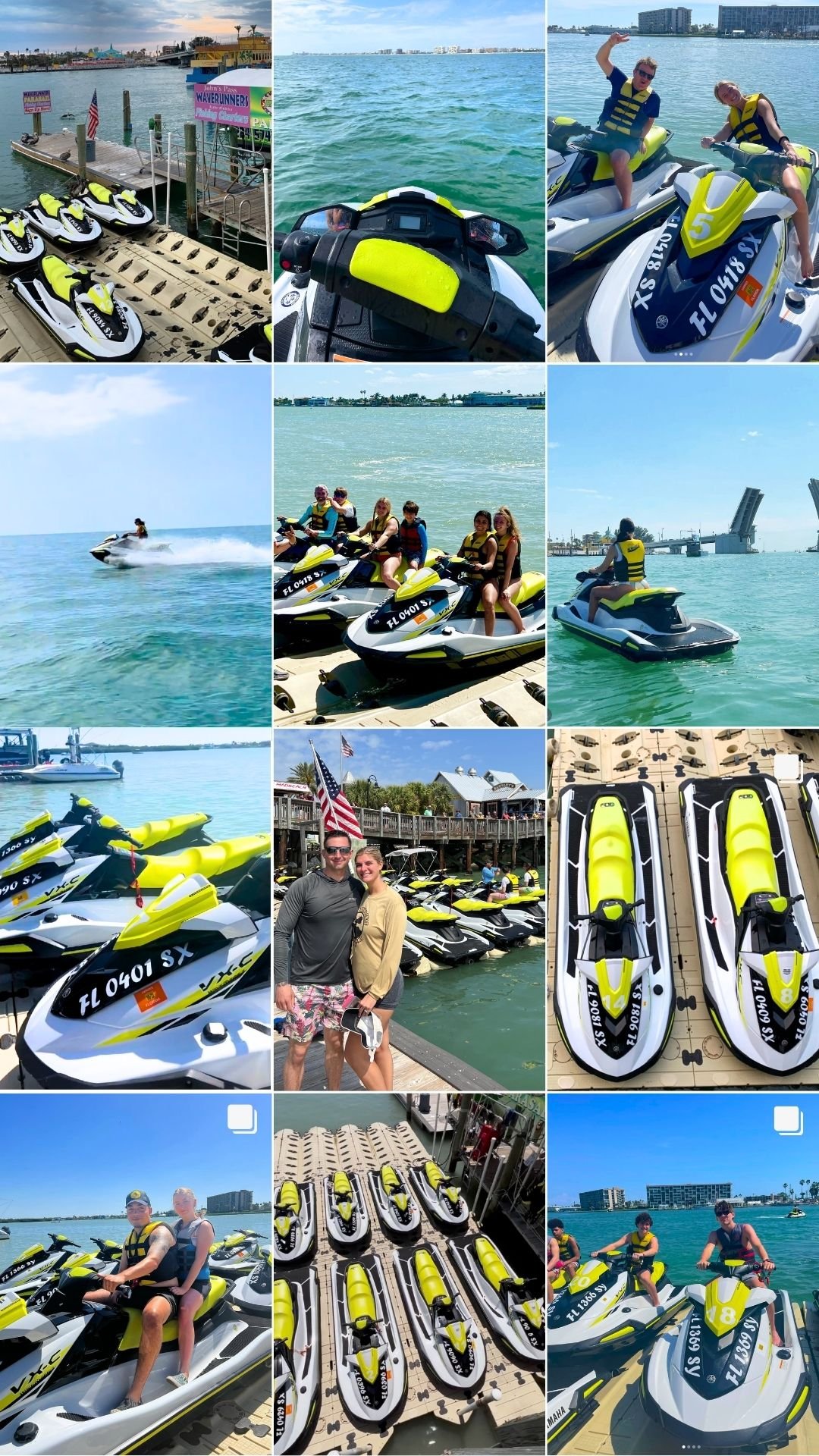 People enjoying jet skis at a marina, with some riding and others parked on the dock, in a coastal city with water, buildings, and a bridge.