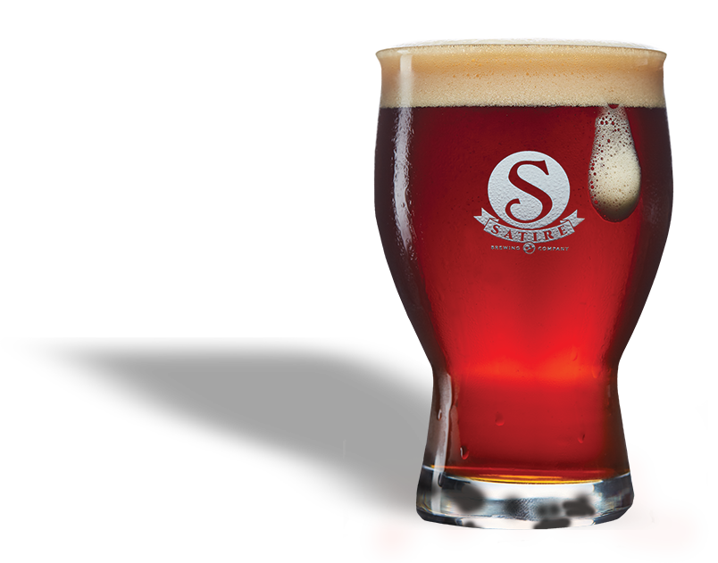 A glass of dark red beer with a foamy head and a logo featuring a large 'S' and the words 'Saltire Brewing Company' on it.