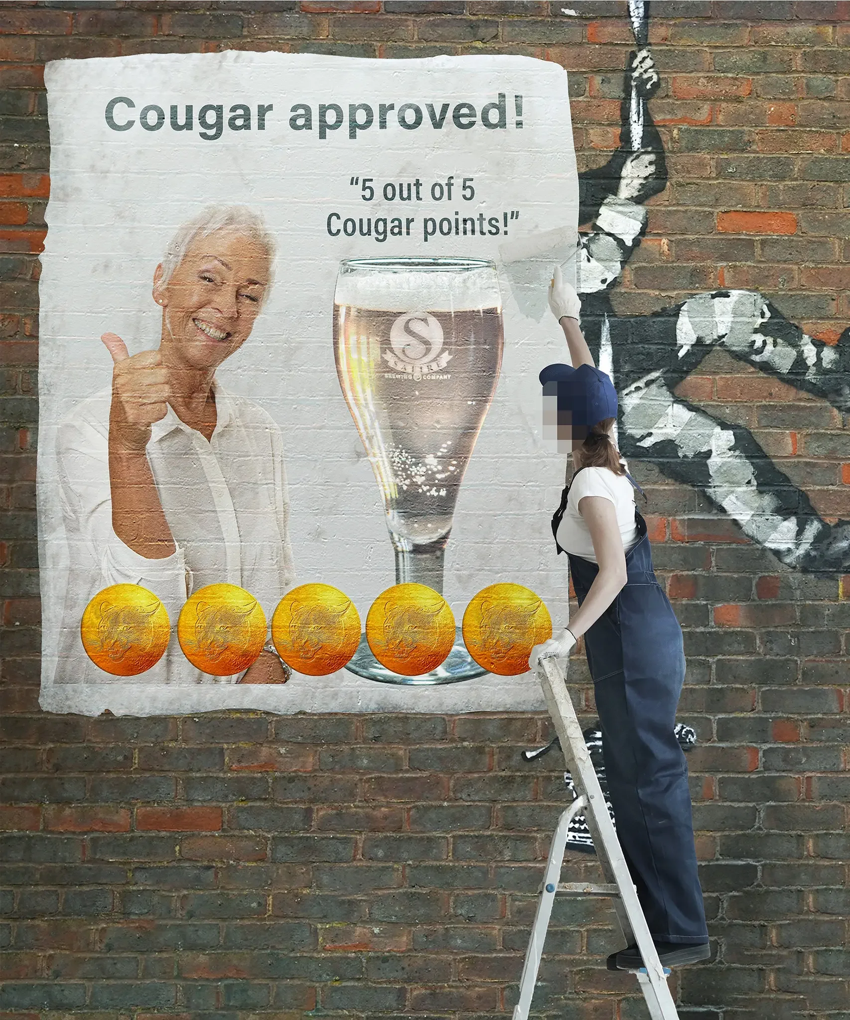 A person wearing a white shirt, jeans, and gloves, standing on a step ladder in front of a brick wall, painting a mural of a black and white cougar climbing on the wall. To the left, there is a poster with a smiling woman giving a thumbs up, with the