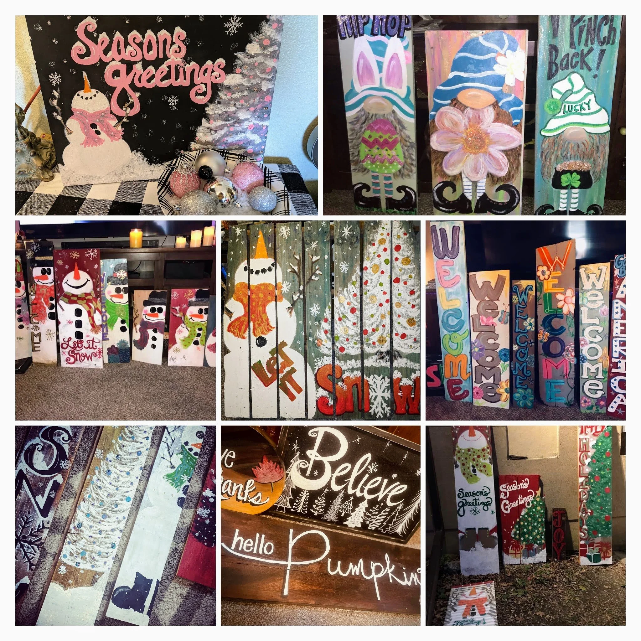 Collection of handmade Christmas and holiday-themed painted decorations including signs with seasonal greetings like "Seasons Greetings," "Welcome," and "Believe," with illustrations of snowmen, snow, and festive symbols.