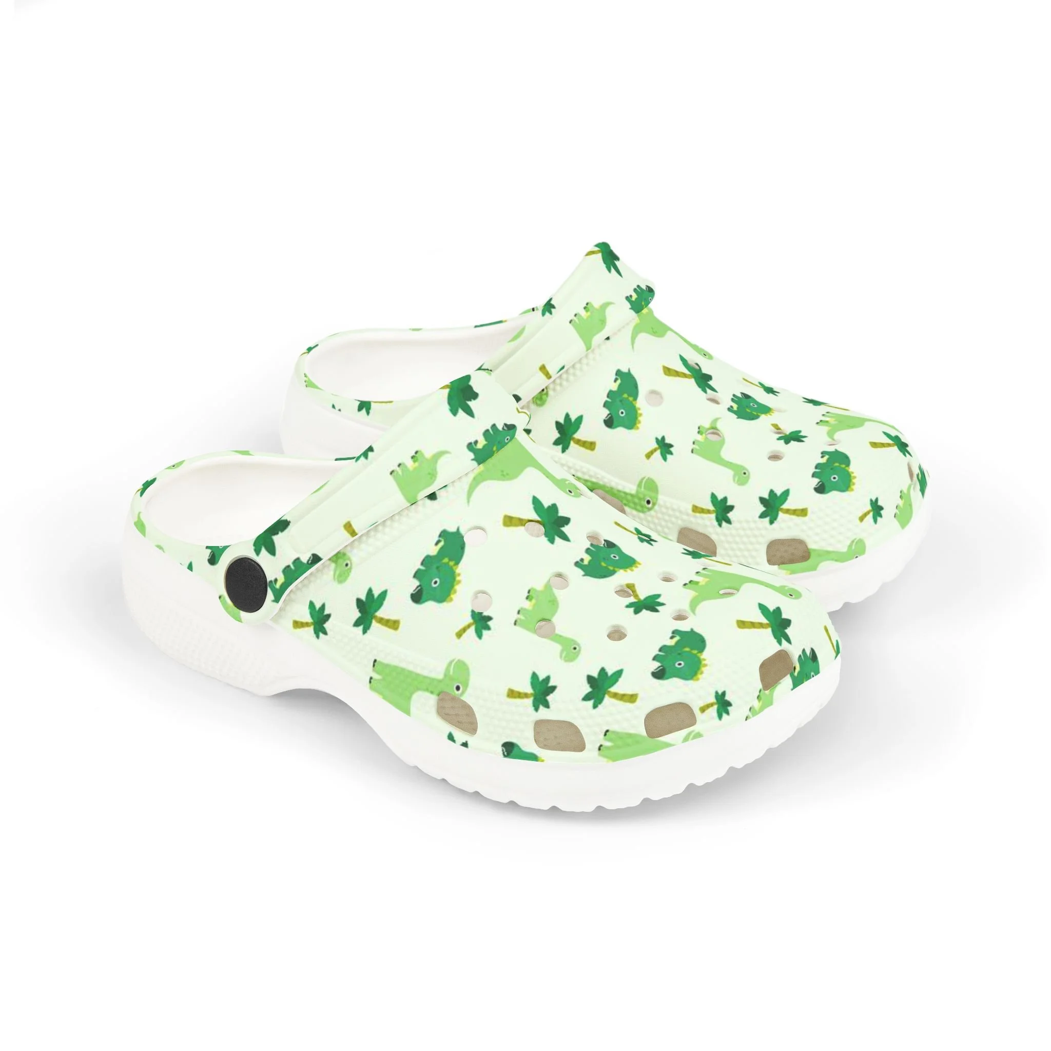 Children's slip-on shoes with green dinosaur and plant pattern on white background