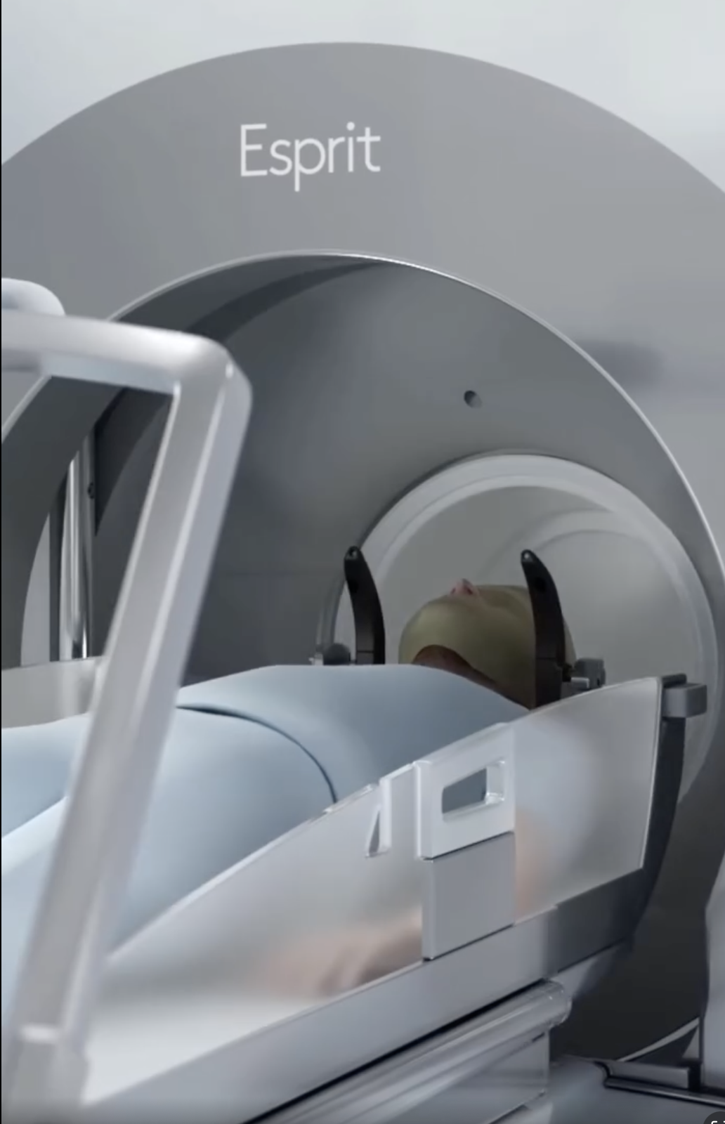 Patient positioned in an Elekta Esprit Gamma Knife radiosurgery unit with head immobilization for stereotactic treatment.