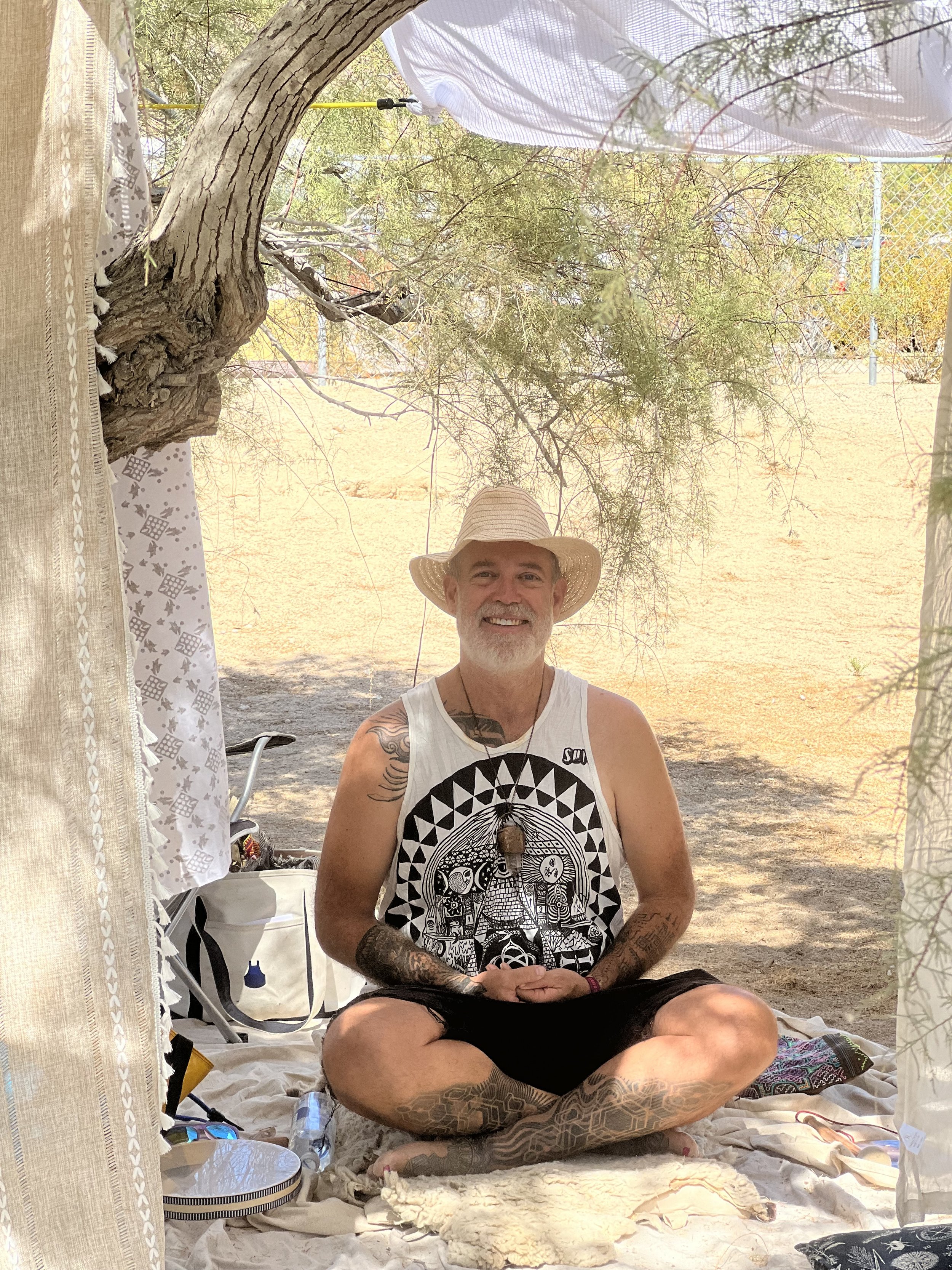 Aaron French Natural Heart Alchemy sitting beneath a tree offering Akashic Readings and Spiritual Mentorship