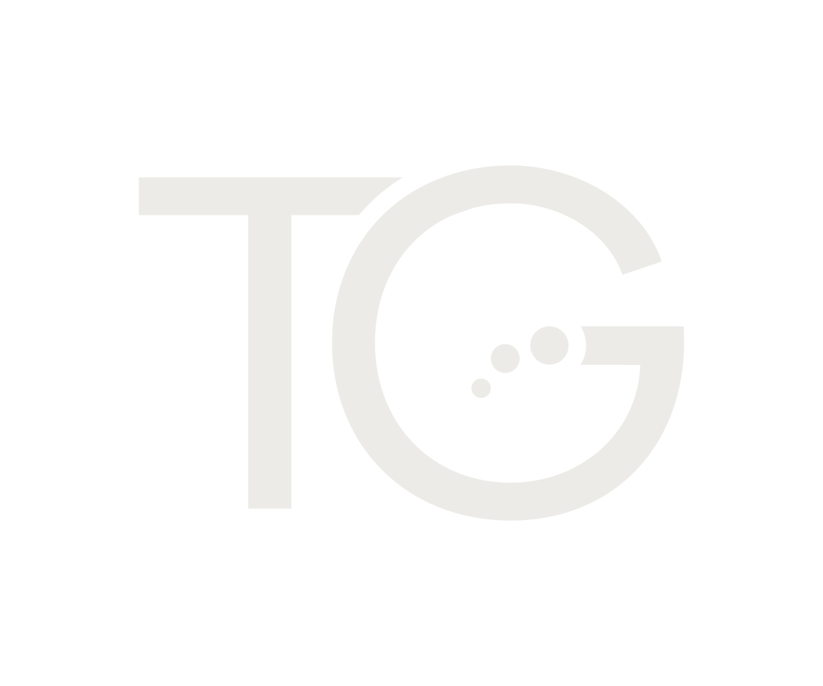 Stylized black and white logo with large letters T and G, and a bubble inside the G for the Tranquil Gardens brand.