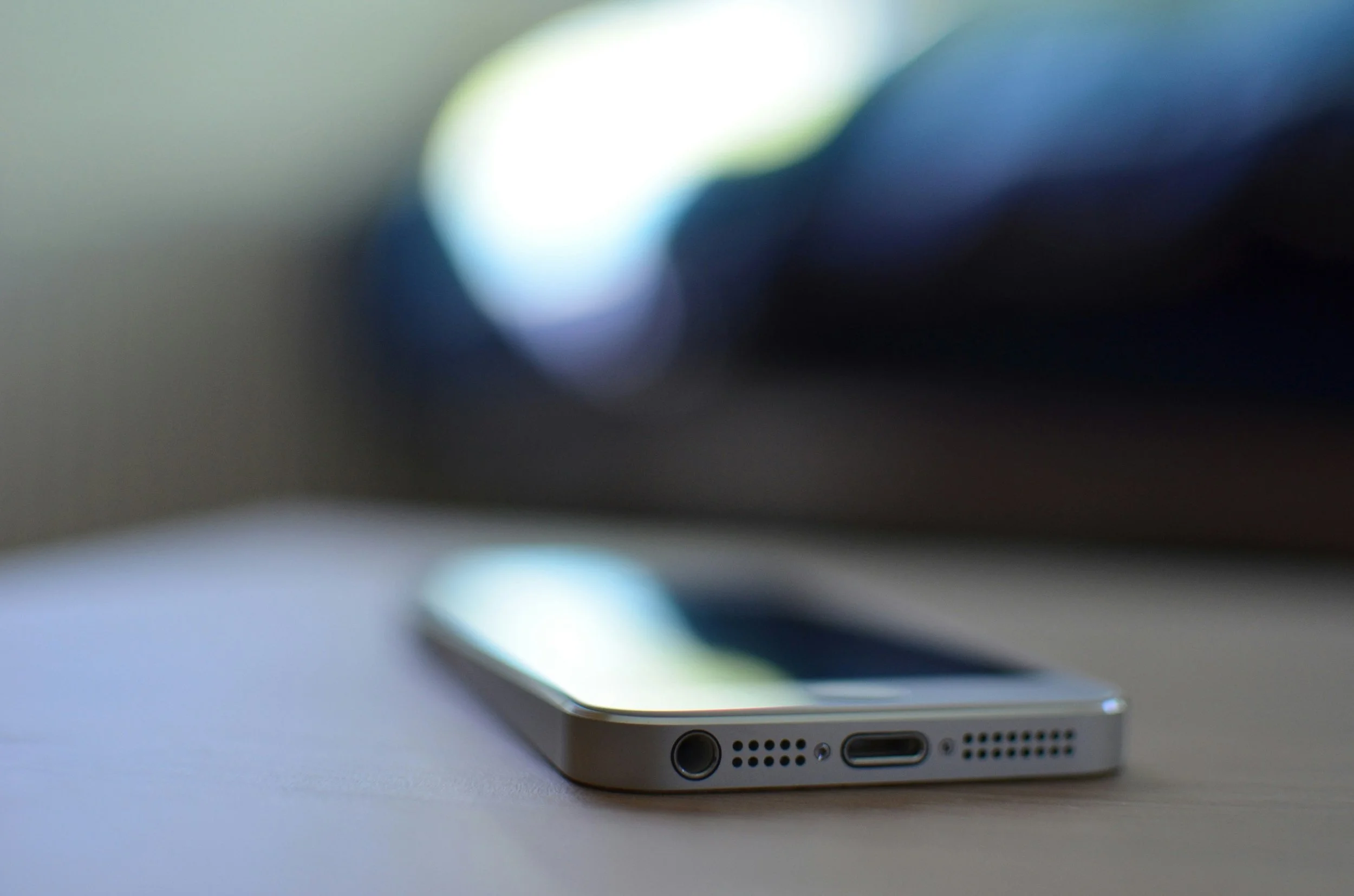 Close-up of a smartphone speaker port needing smartphone repair in Albuquerque