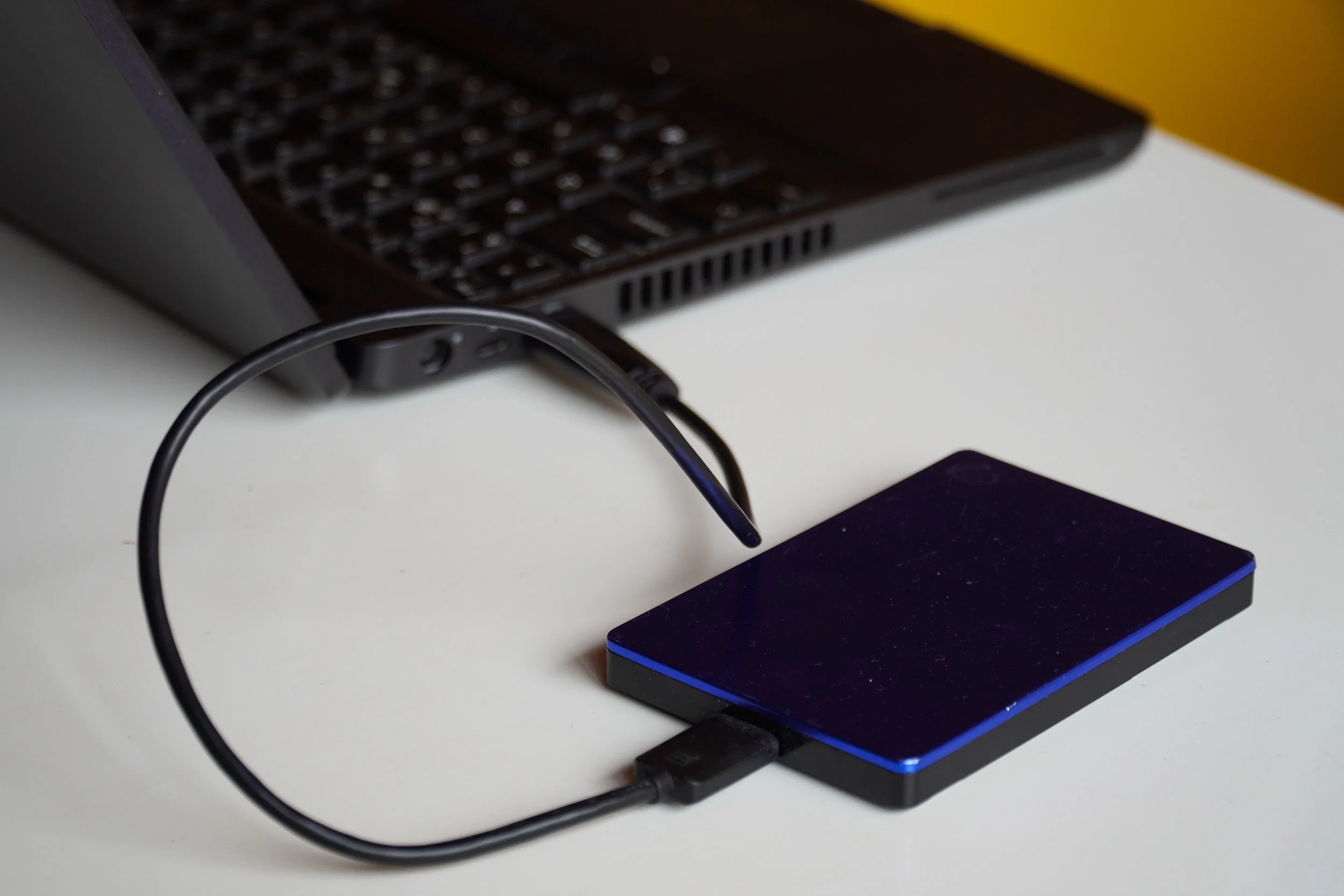 External hard drive connected to a laptop.
