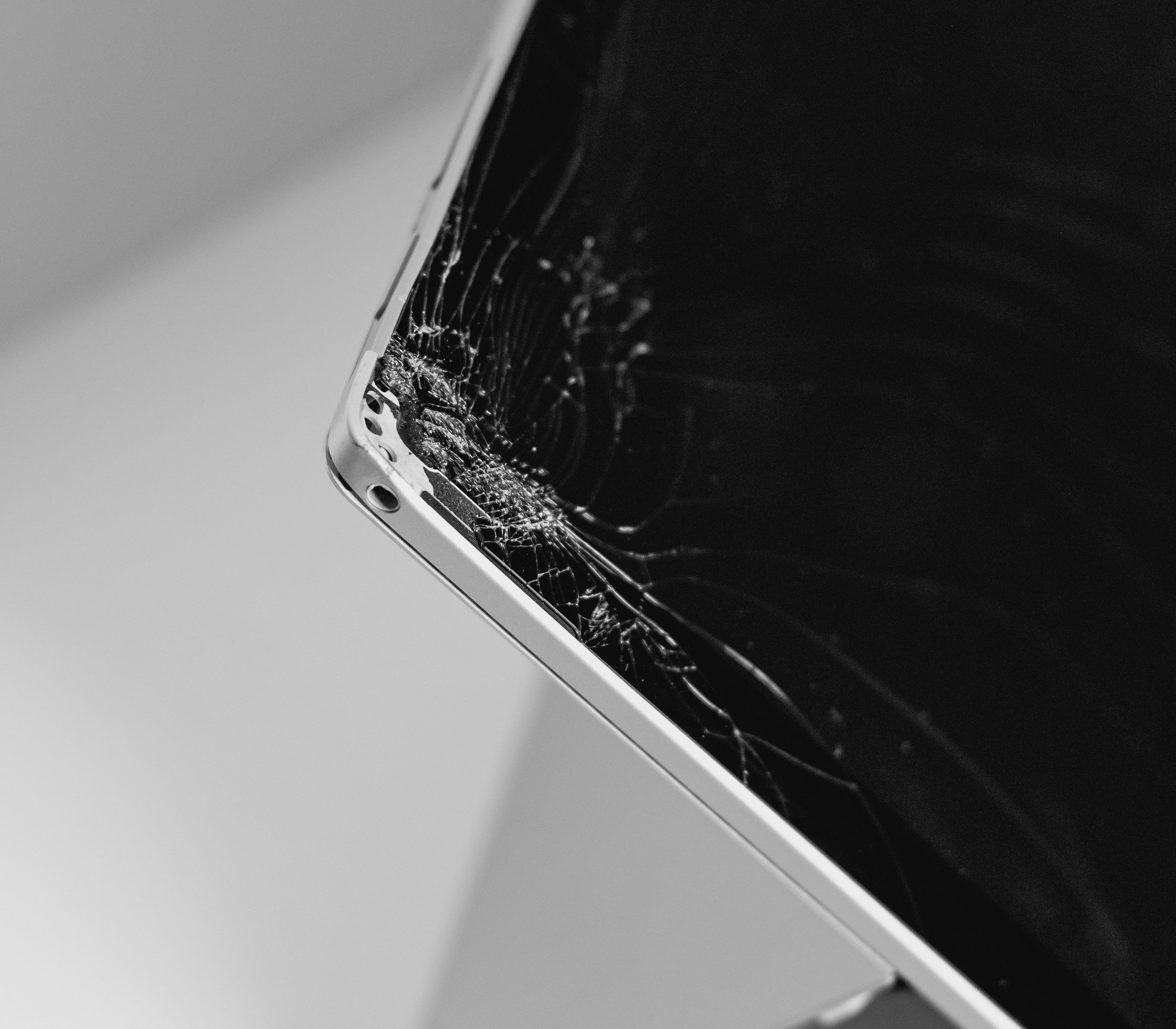 Close-up of a cracked laptop screen