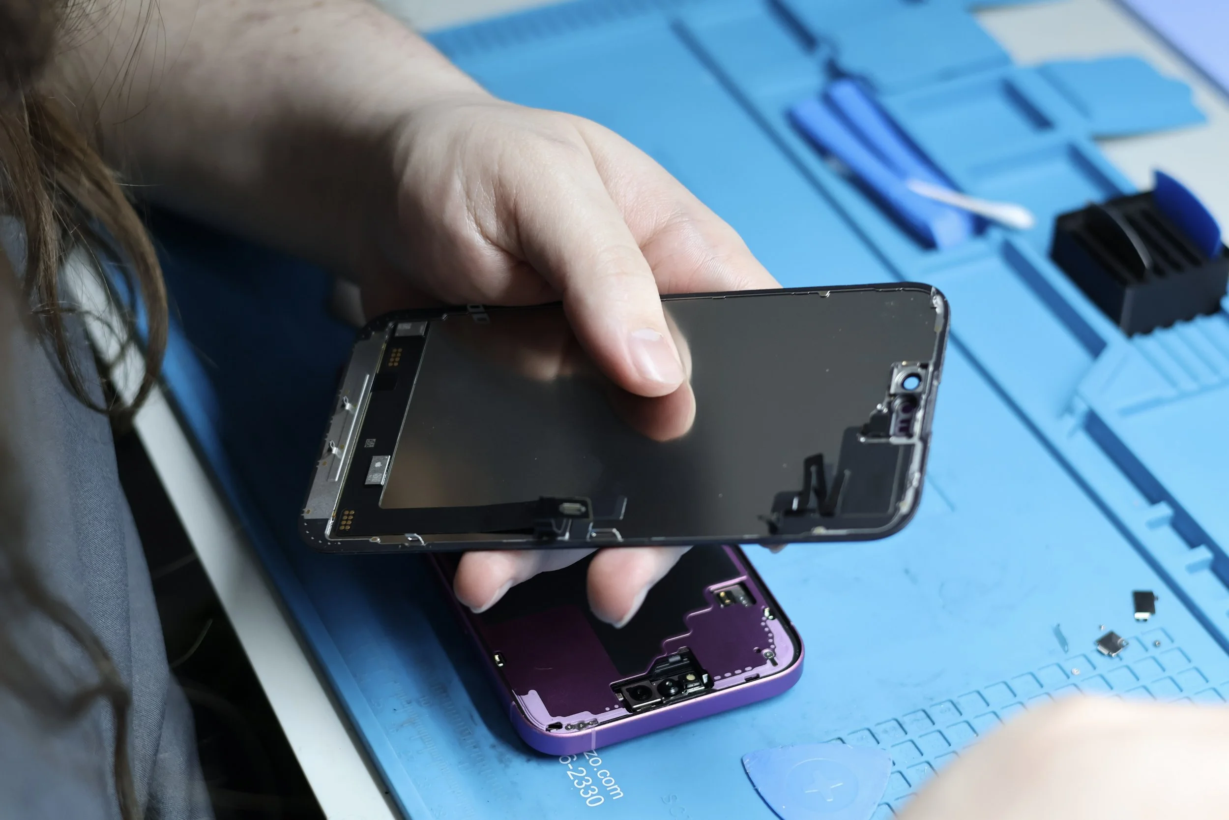 Close-up of a phone screen needing replacement and screen repair in Albuquerque