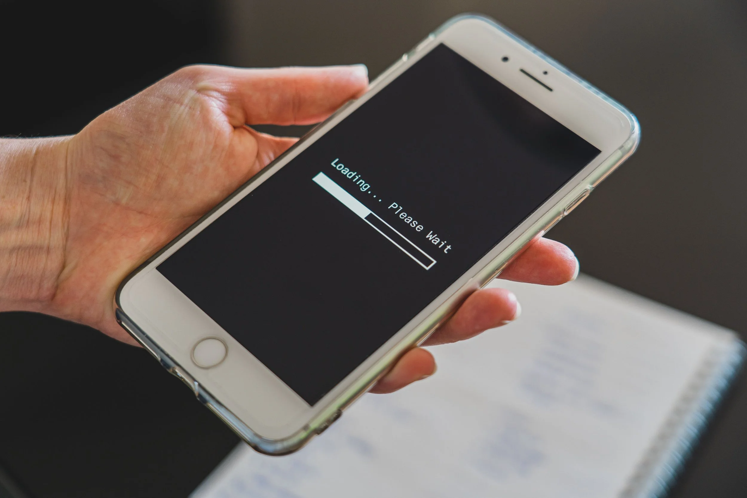 Phone screen displaying a loading animation.