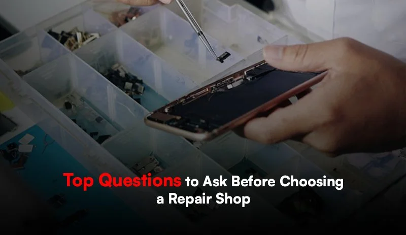 Close-up of hands fixing a smartphone at Phone Fix Place.