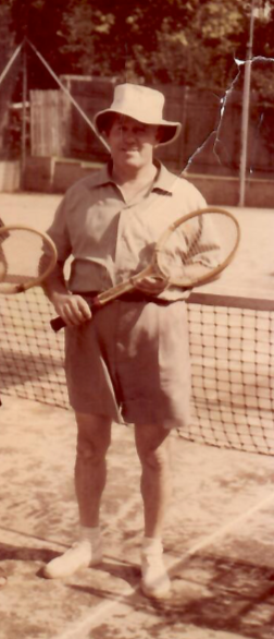 Noel Dumas, founder of the JAK's family hospitality legacy, holding a tennis racket