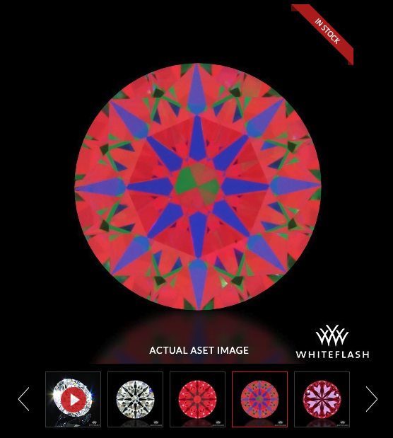 Colorful circular kaleidoscope pattern with red, blue, green, and purple shapes on a black background. ASET scope image showing the arrows of hearts and arrow diamonds from White Flash