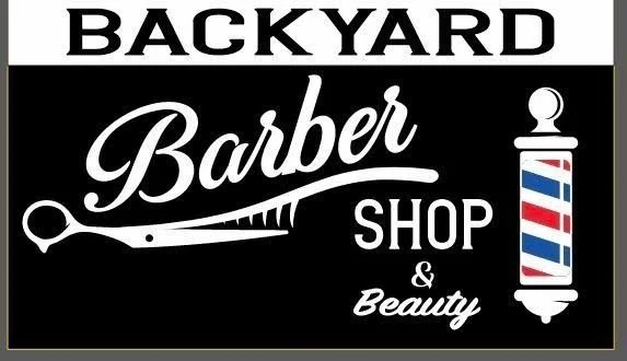 Sign for a backyard barber shop and beauty salon with a barber pole and scissors logo.