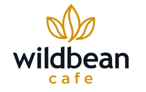 Logo for Wild Bean Café featuring a stylized orange and green leaf design above the text "wildbean" in black and blue, with "café" in orange below.