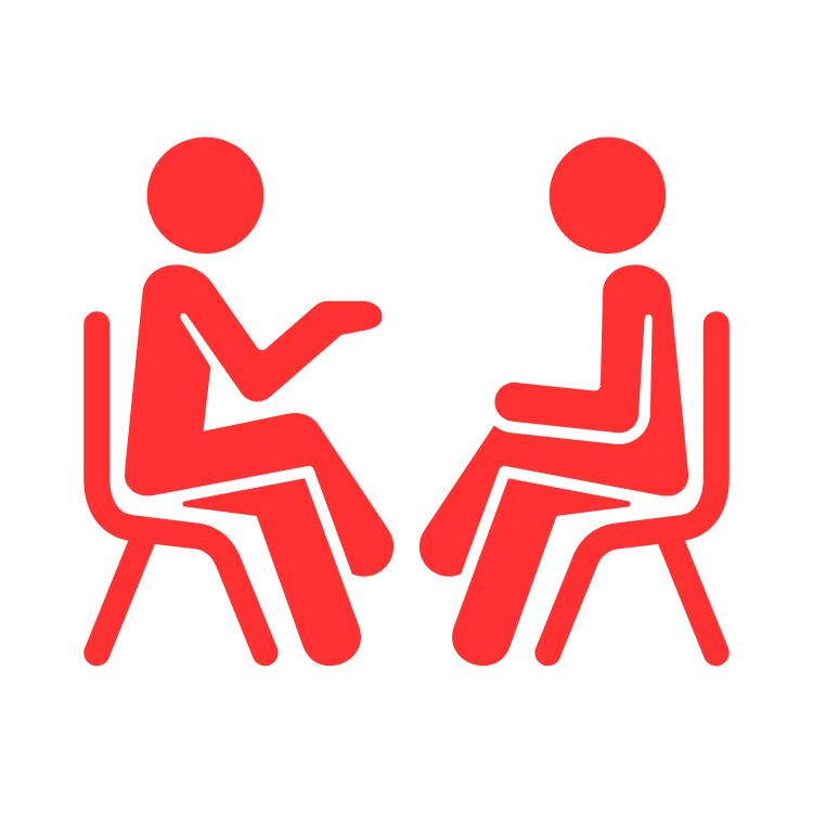 Two red pictograms of people sitting across from each other engaged in conversation.