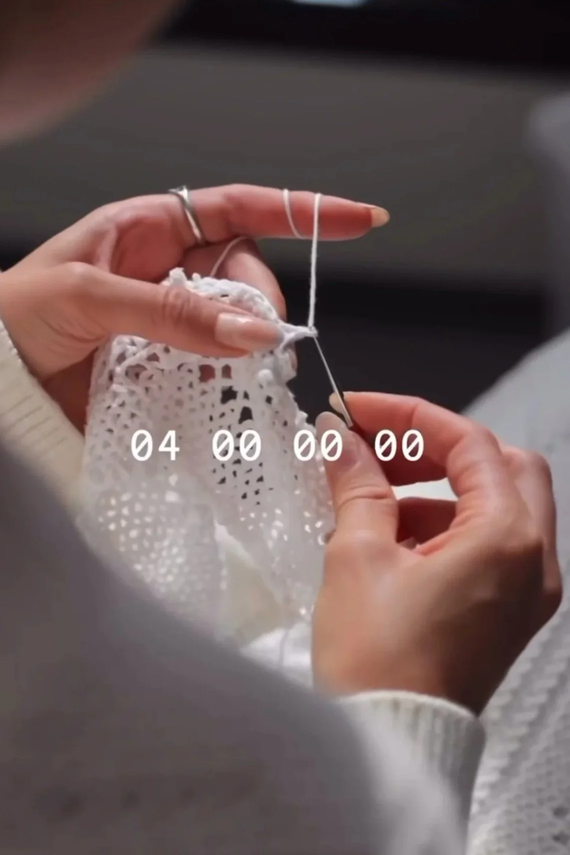 Close-up of hand-crocheted lace construction and garment assembly for Holzweiler SS24 runway showpiece