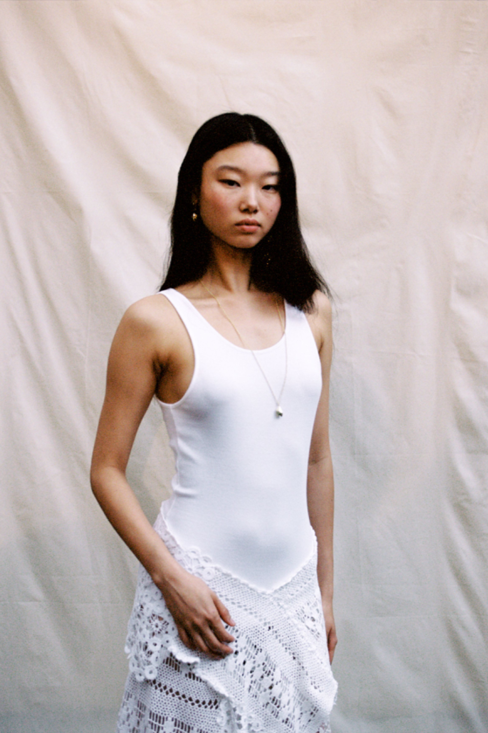 Close-up of hand-crocheted lace construction and garment assembly for Holzweiler SS24 runway showpiece