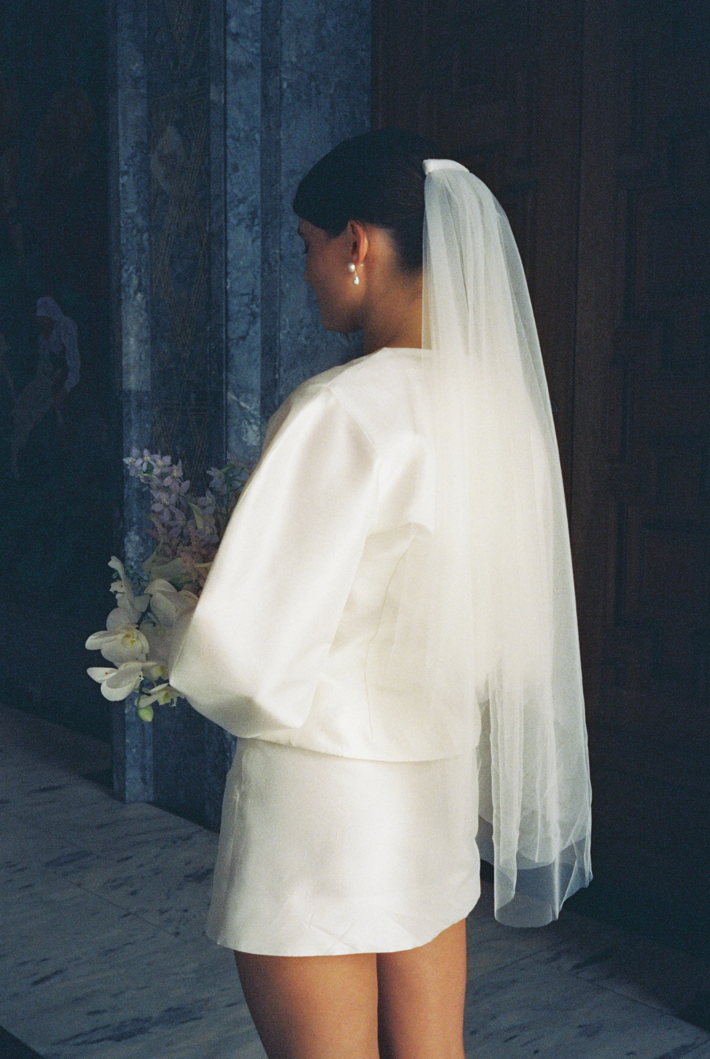 Tailored silk bridal ensemble showcasing clean seams, balanced proportions, and timeless craftsmanship.